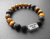Engraved stainless steel bracelet with brown tiger eye and volcano rock beads
